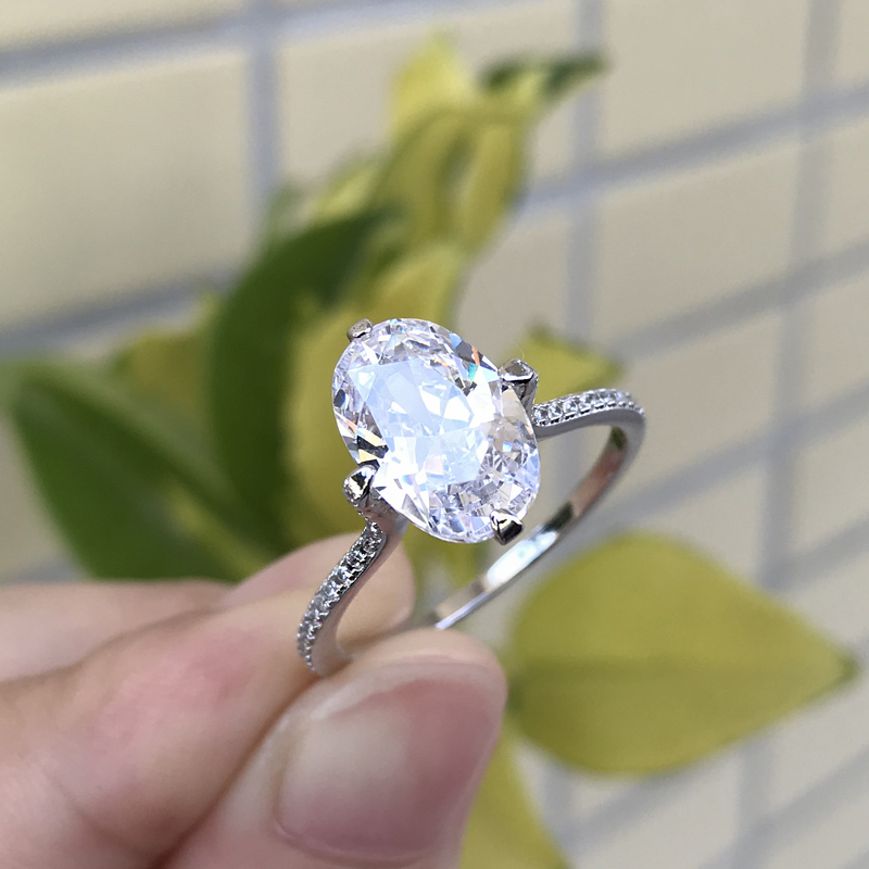 CLASSIC OVAL CUT SIMULATED DIAMOND ENGAGEMENT RING IN U-SHAPED WHITE GOLD