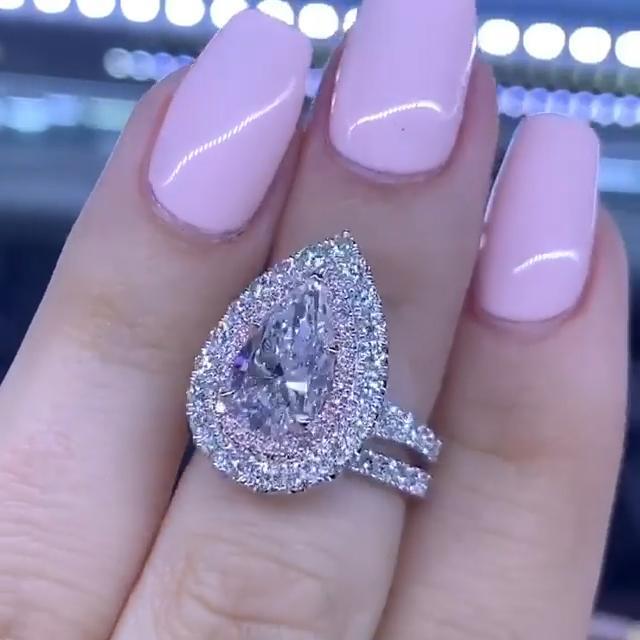 Pear Cut Split Shank Ring Set With A Two Tone Double Halo